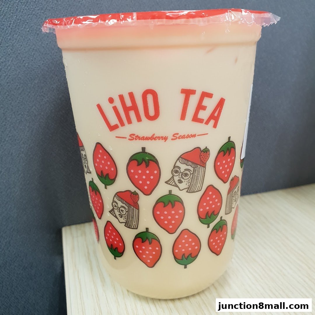 A LiHO TEA cup with strawberry-themed designs and the text 'Strawberry Season'.