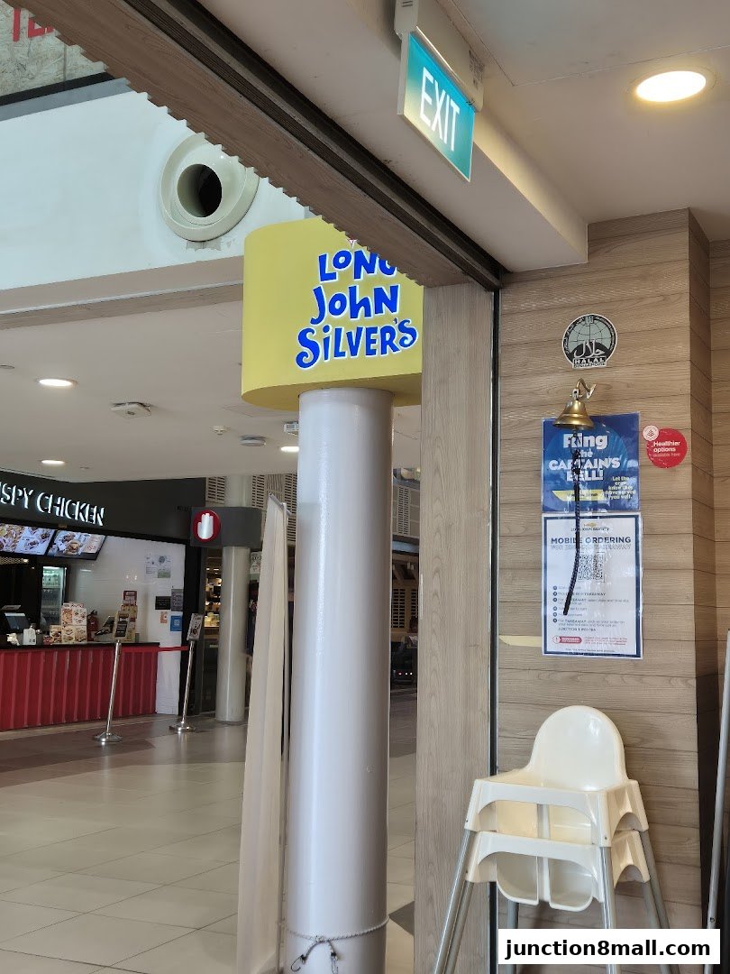 Entrance to Long John Silver's with a prominent yellow sign and an exit sign above.