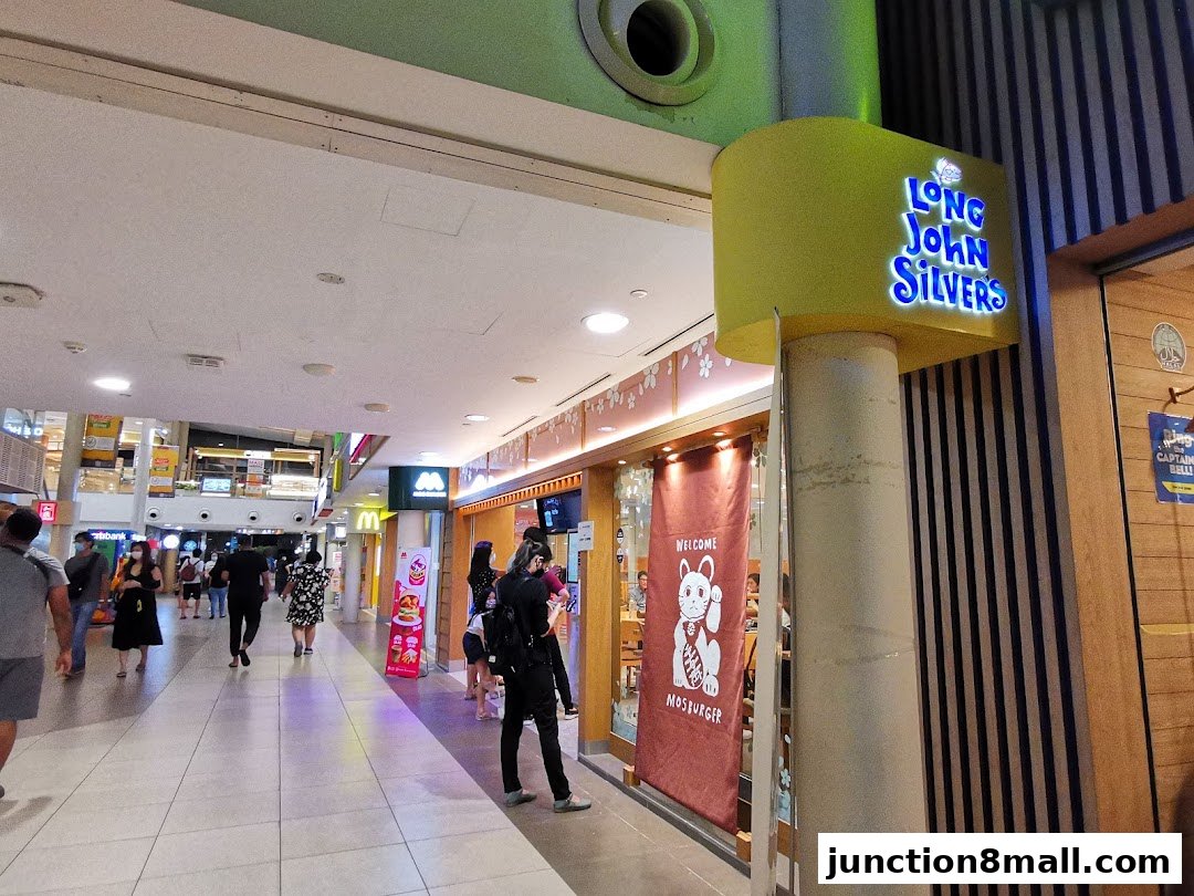 The exterior of a Long John Silvers restaurant with its illuminated sign and entrance.