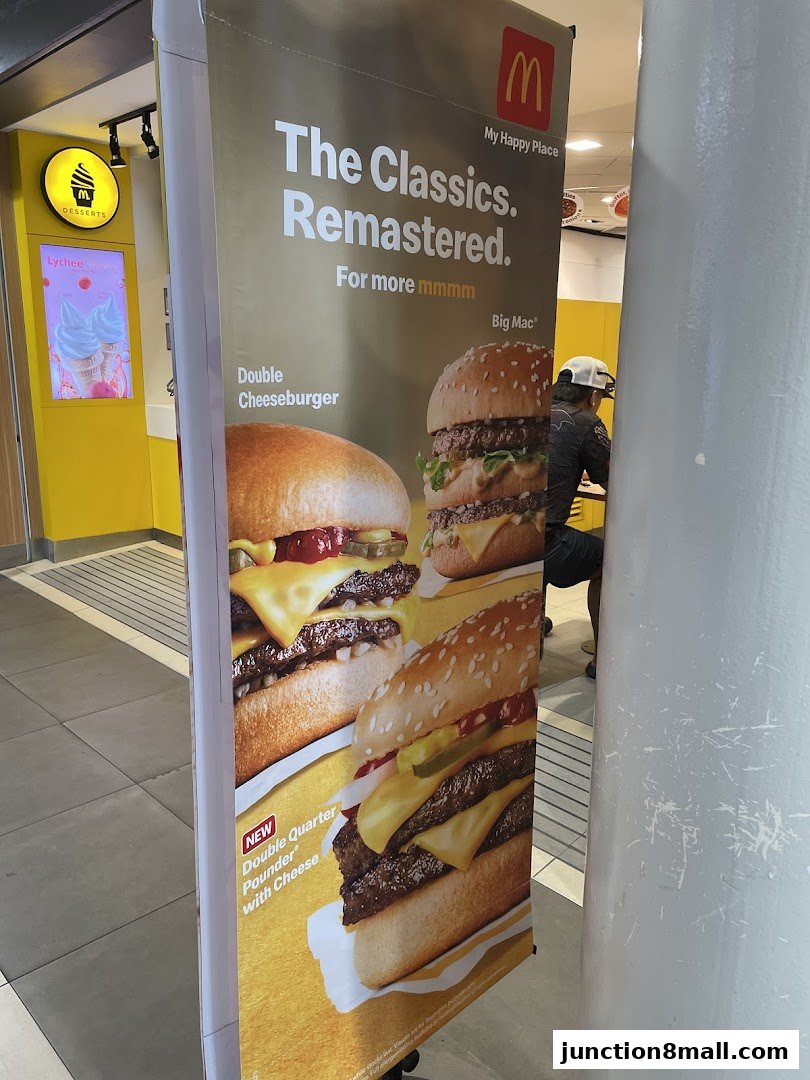 A promotional banner for McDonald's featuring classic burgers like the Big Mac and Double Cheeseburger.