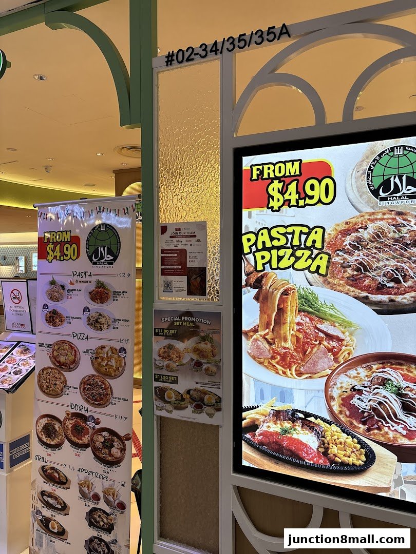 Shop front with promotional posters for pasta, pizza, and set meals.