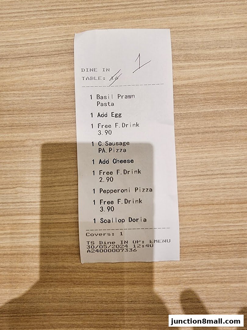 A receipt from Milan Shokudo Junction 8 showing dine-in orders and prices.