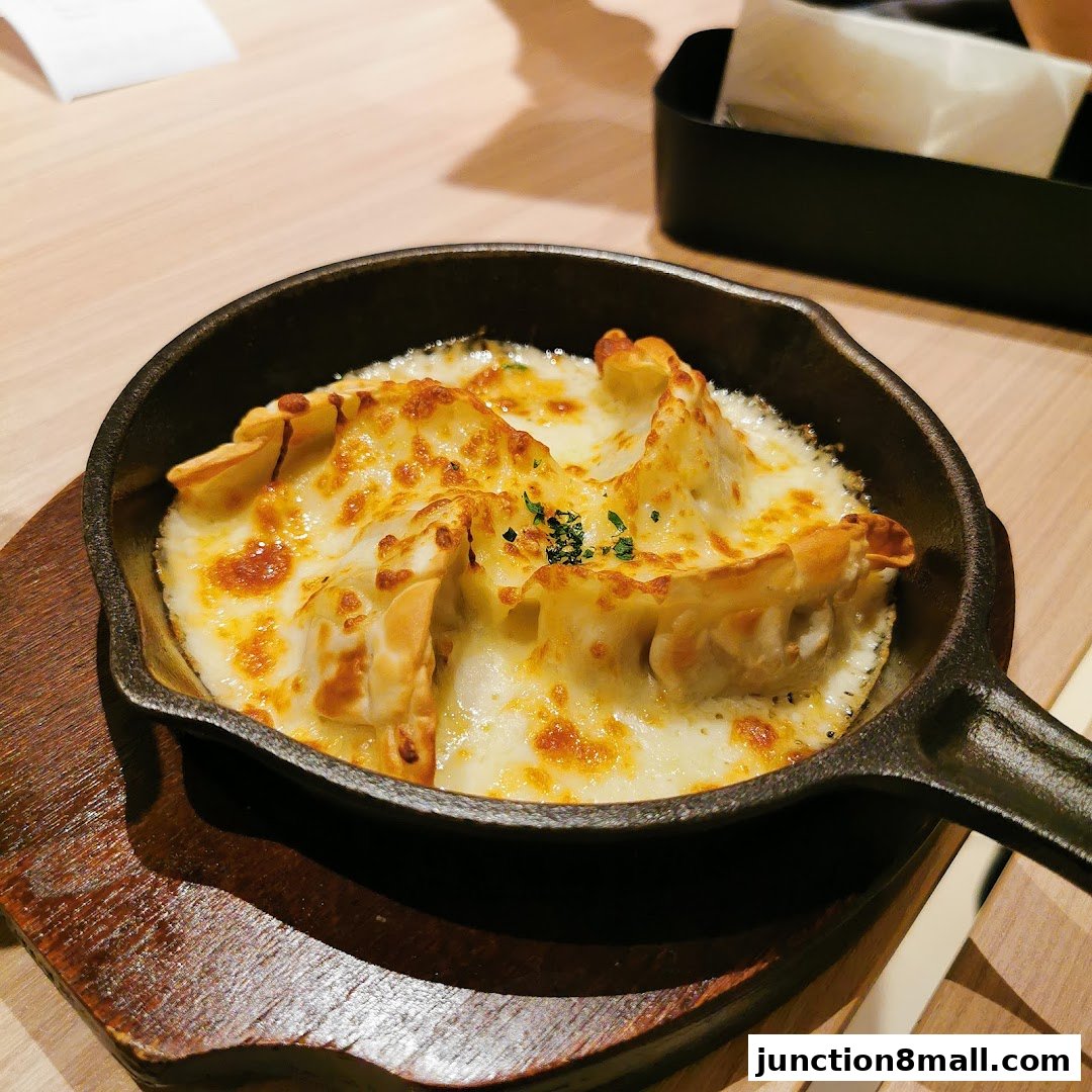 A cast iron skillet filled with cheesy baked dumplings, garnished with parsley.
