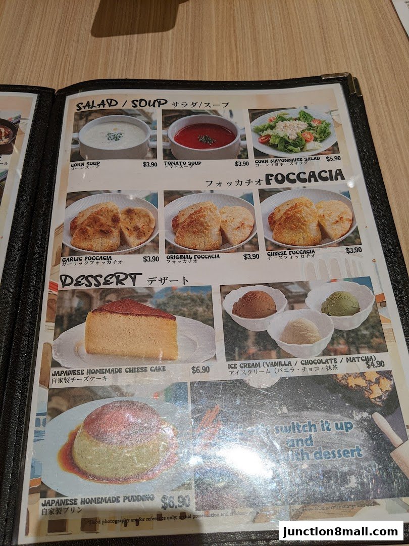 A menu page featuring salads, soups, focaccia, desserts like cheesecake and pudding, and ice cream.