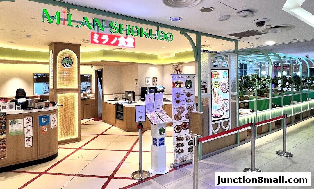 The entrance of Milan Shokudo Junction 8, a Japanese restaurant with a modern and inviting interior.