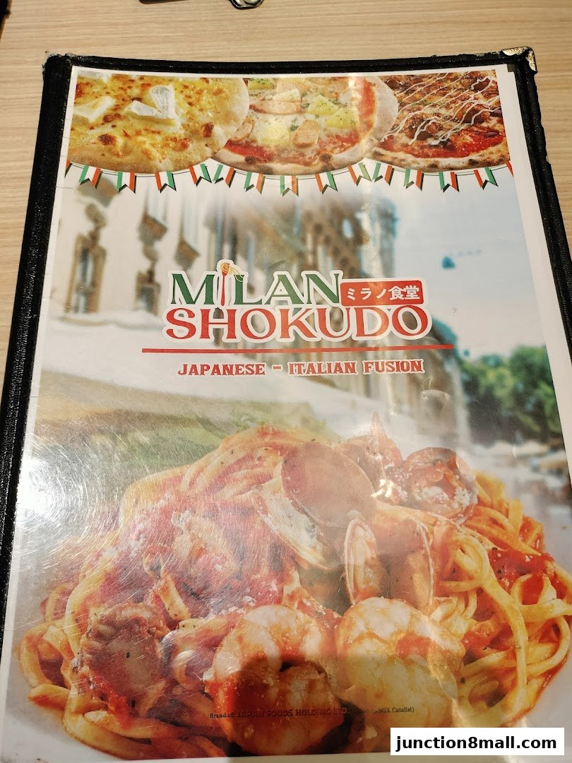 A menu from Milan Shokudo featuring Japanese-Italian fusion cuisine with images of pizza and pasta.