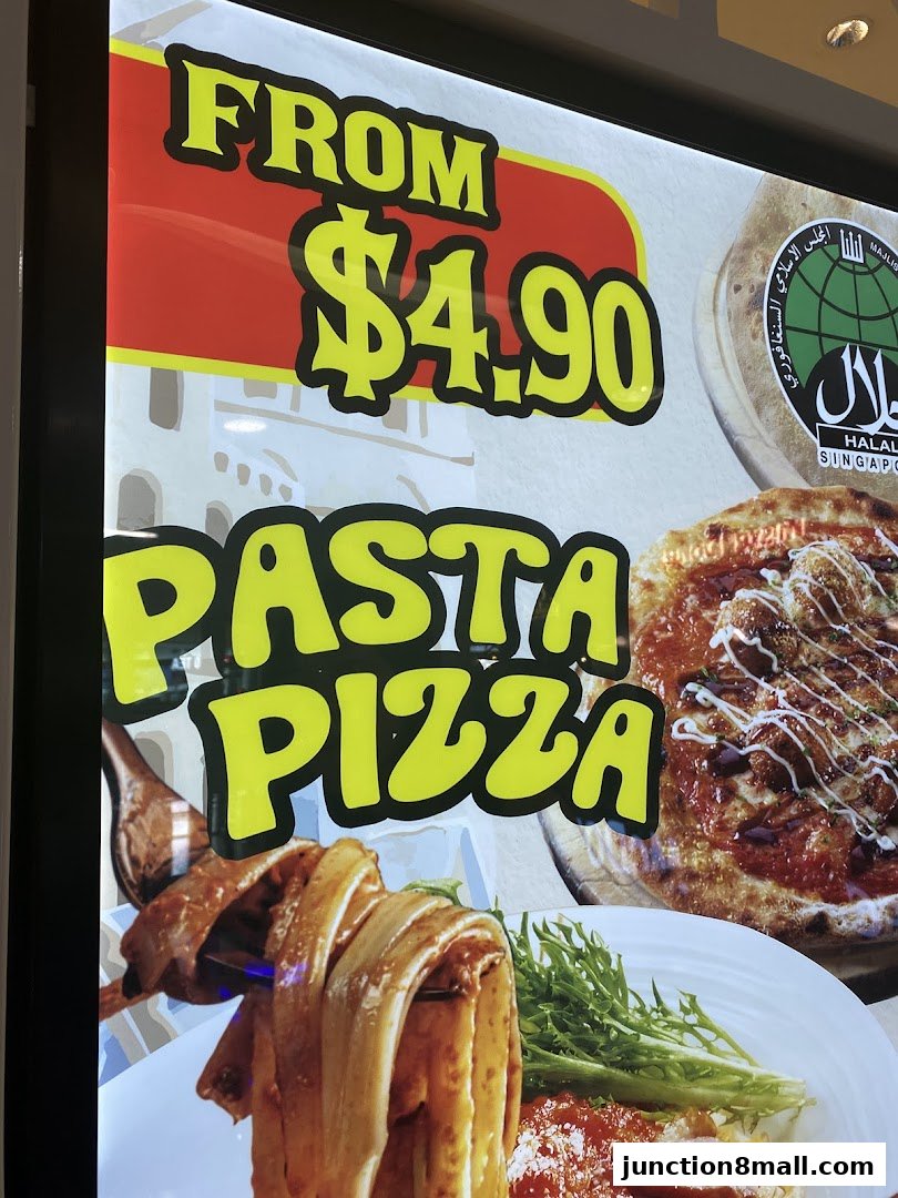 A sign advertising pasta and pizza from $4.90, with a Halal certification.