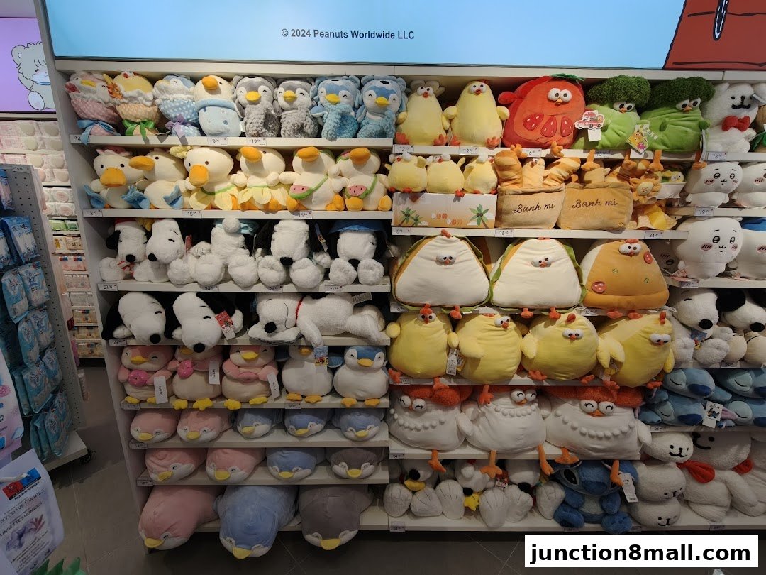 Shelves filled with various cute plush toys, including penguins, Snoopy, and food-themed characters.