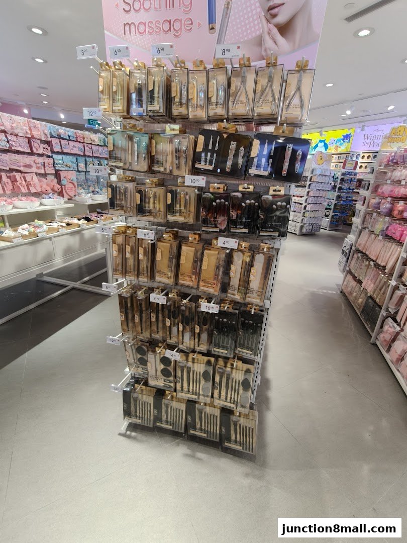 A display of personal care and beauty tools, including nail clippers and makeup brushes.