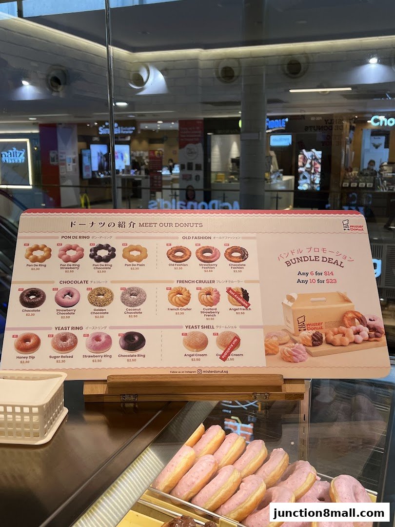A menu board showcasing various donuts from Mister Donut with prices and bundle deals.