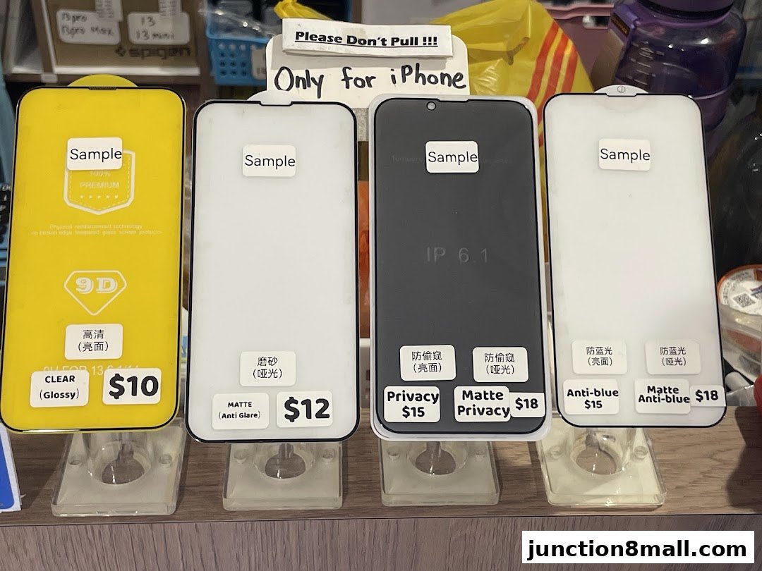 A display of various iPhone screen protectors with prices and descriptions.