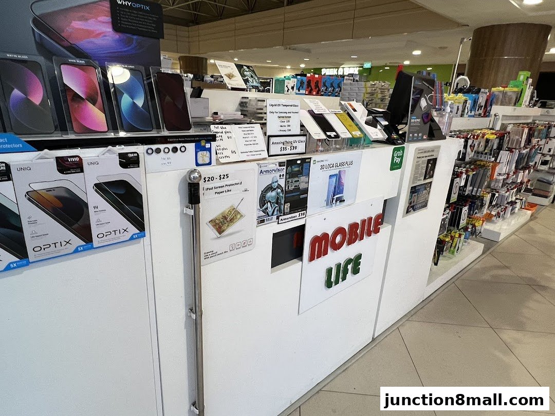 A retail shop display featuring phone accessories, screen protectors, and repair services.