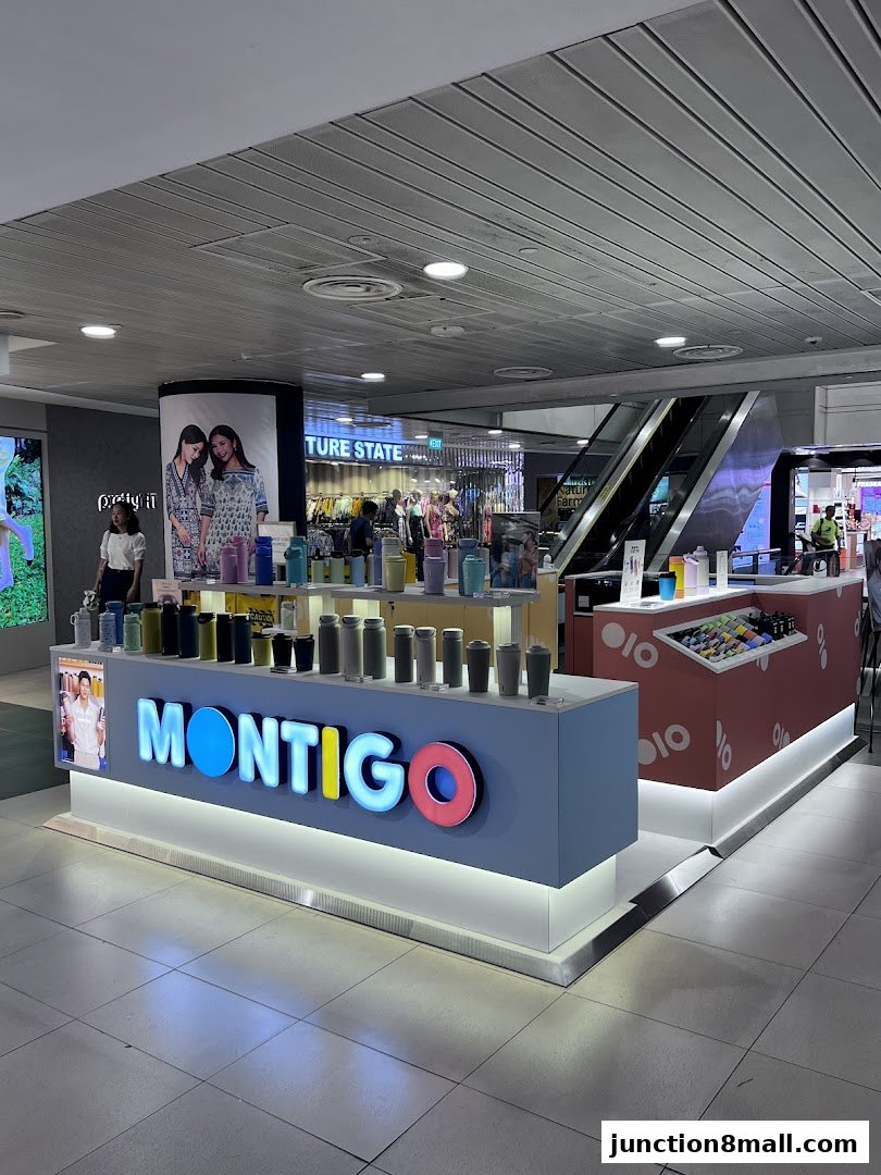 A Montigo store kiosk displaying various water bottles and accessories.