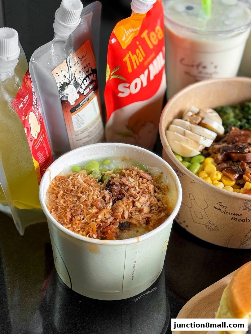 A close-up of various Mr Bean food and drink items, including soy milk pouches and bowls of food.