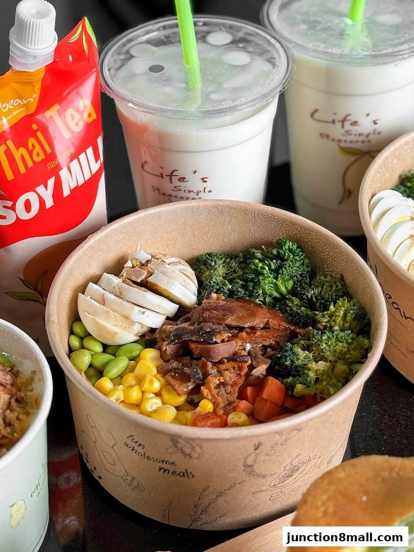 A close-up of healthy grain bowls and Thai Tea Soy Milk from Mr Bean.