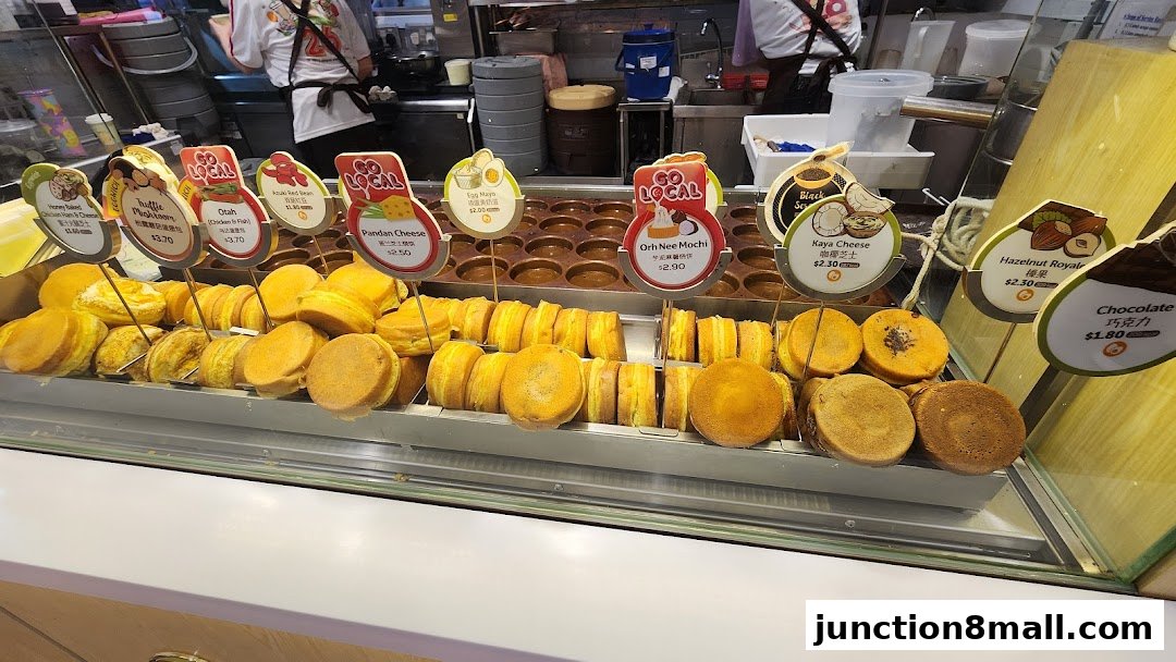 A display of freshly made, round pastries with various fillings and toppings.