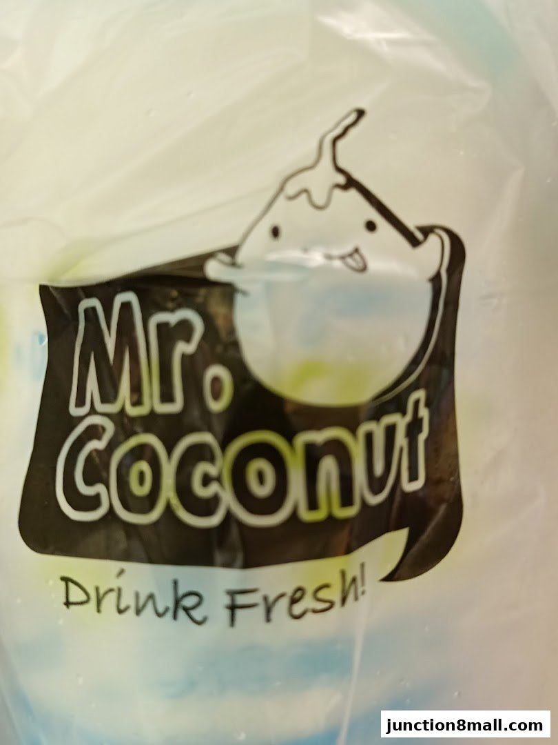 A close-up of a plastic bag with the Mr. Coconut logo and slogan.