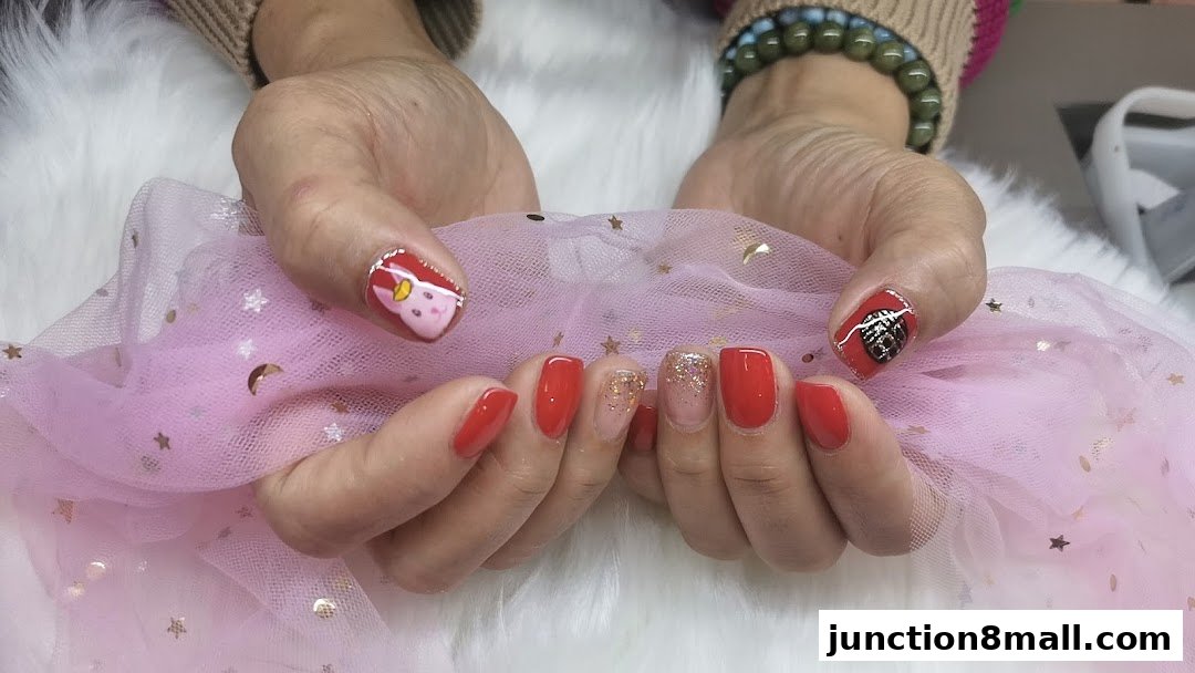 Close-up of hands with beautifully decorated nails, featuring festive designs and vibrant colors.