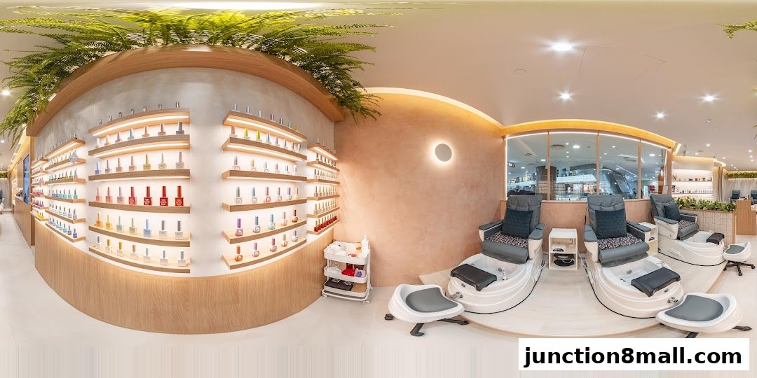 Interior of a modern nail salon with pedicure chairs and shelves stocked with nail polish.