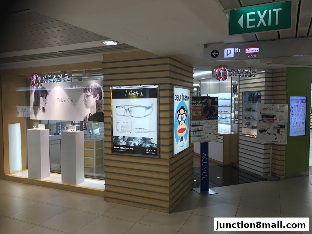 Nanyang Optical shop front with displays of glasses and advertising posters.