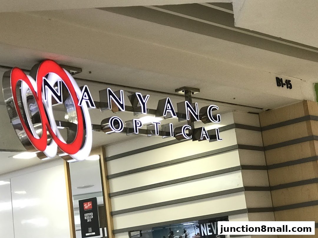 The illuminated sign for Nanyang Optical, a shop selling eyewear.
