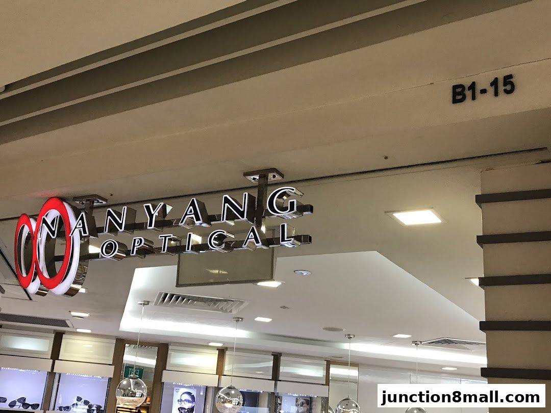 The illuminated sign for Nanyang Optical is displayed prominently above the shop entrance.