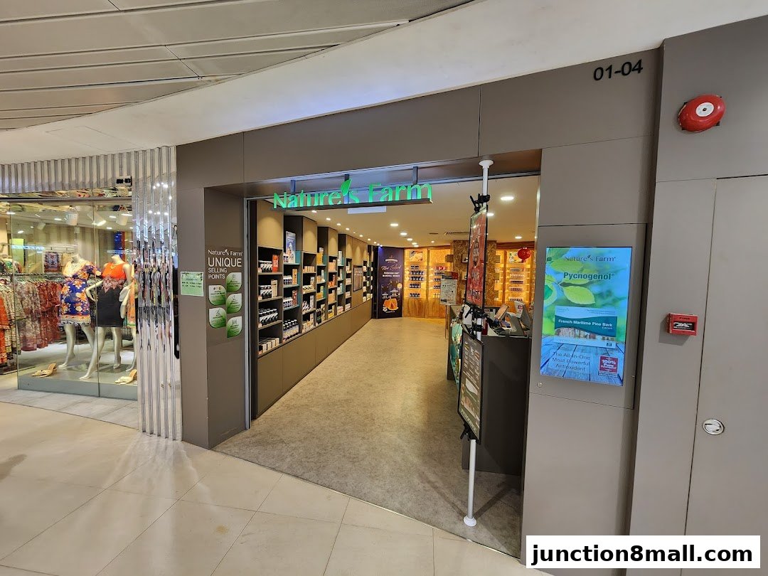 The entrance to Nature's Farm shop, showcasing health products and a digital display.