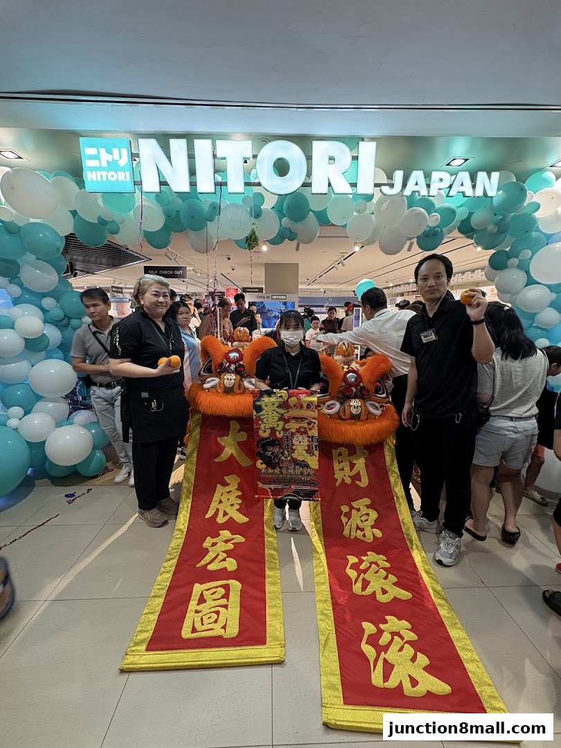 NITORI JAPAN store entrance decorated with balloons and lion dance banners for a festive opening.