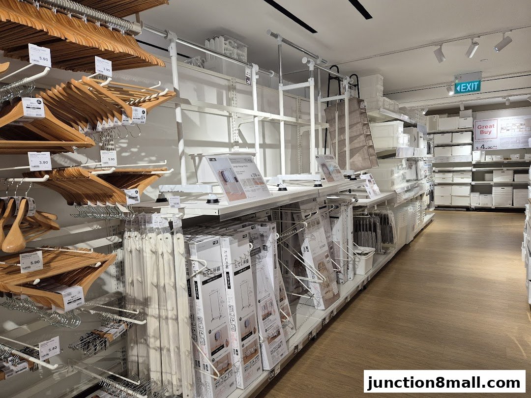 Interior view of a NITORI store showcasing various home organization products and hangers.
