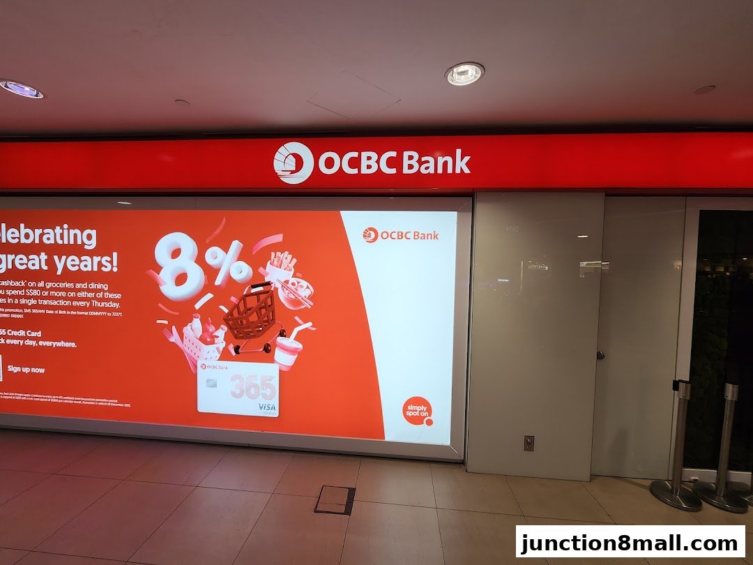 The OCBC Bank storefront features a large advertisement for an 8% cashback promotion on groceries and dining.
