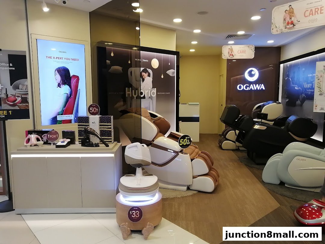 Interior view of an OGAWA store showcasing various massage chairs and wellness products.