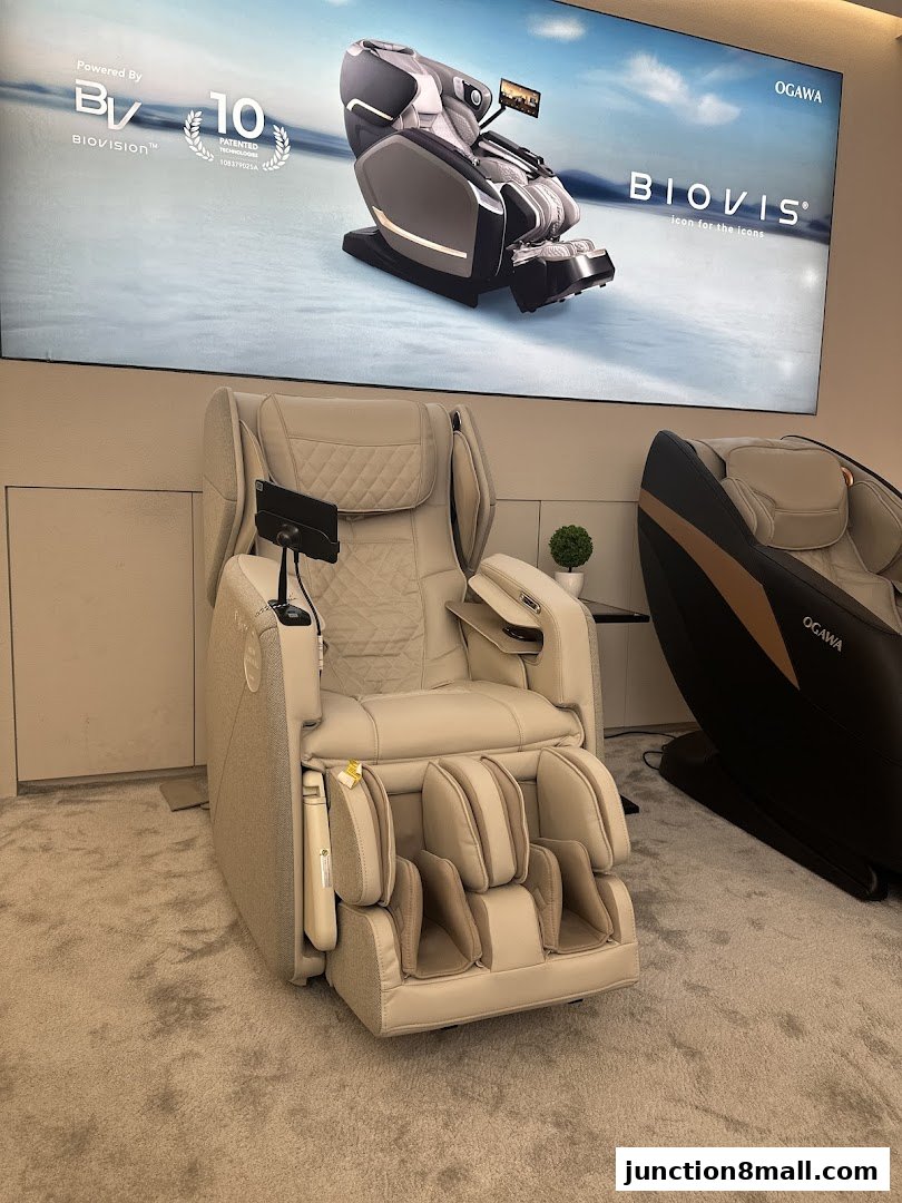 A display of OGAWA massage chairs, featuring the BIOVIS model with advanced technology.
