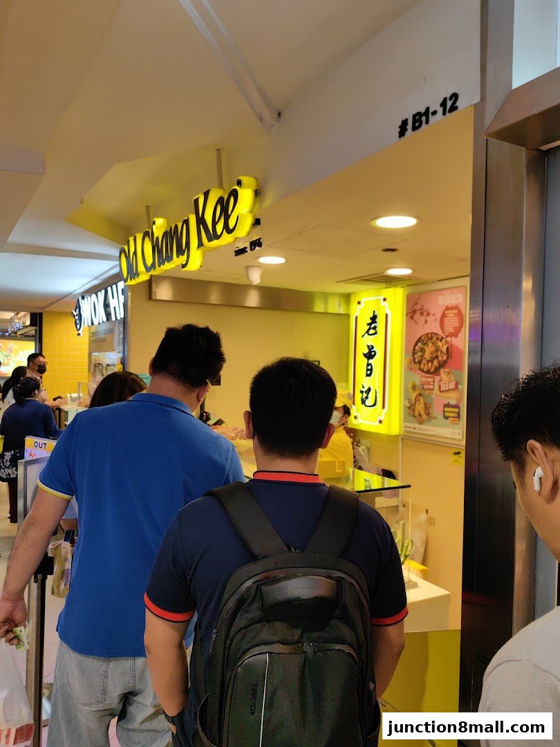 People queuing at the Old Chang Kee shop, a popular eatery known for its snacks.