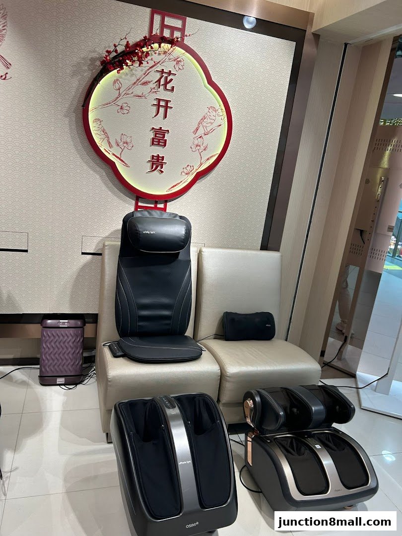 OSIM shop interior featuring massage chairs and foot massagers with decorative wall art.