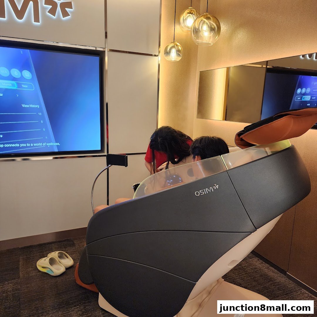 A person sits in an OSIM massage chair with a screen displaying wellness data.