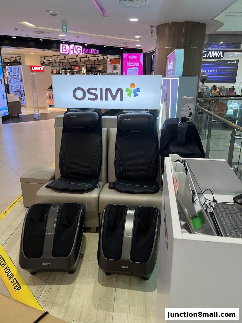 OSIM massage chairs and foot massagers displayed in a shopping mall.
