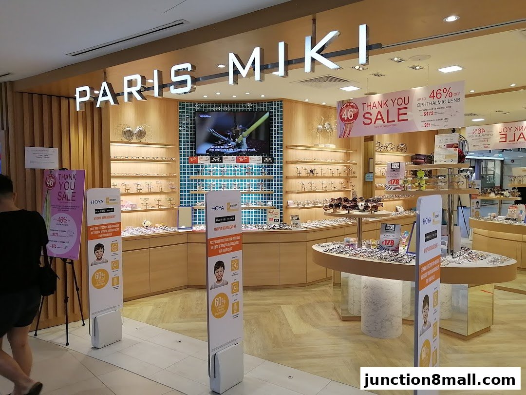 Paris Miki optical shop interior with displays of spectacles and promotional signage.