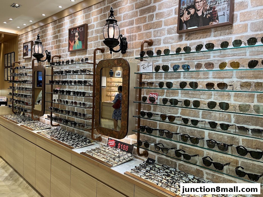 An optical shop interior displaying a wide selection of sunglasses and eyeglasses on shelves.