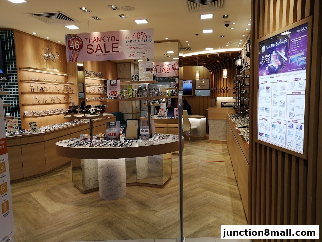 Interior of an optical shop with displays of spectacles and contact lenses.
