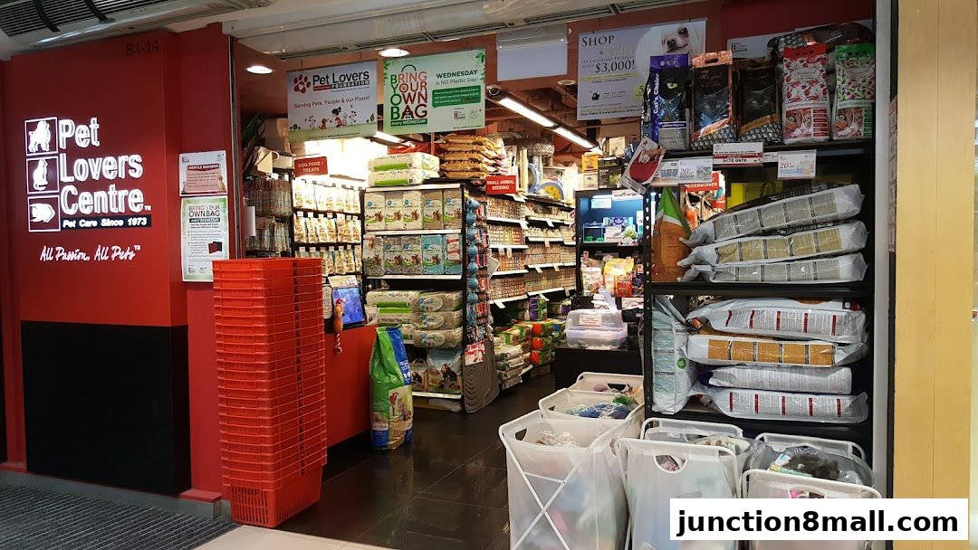 The entrance of Pet Lovers Centre, a pet supply store, with shelves stocked with pet food and accessories.