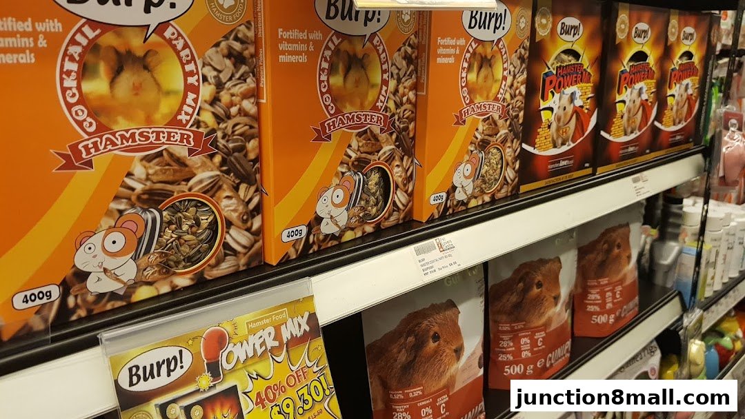 Shelves stocked with various hamster and guinea pig food products at Pet Lovers Centre.