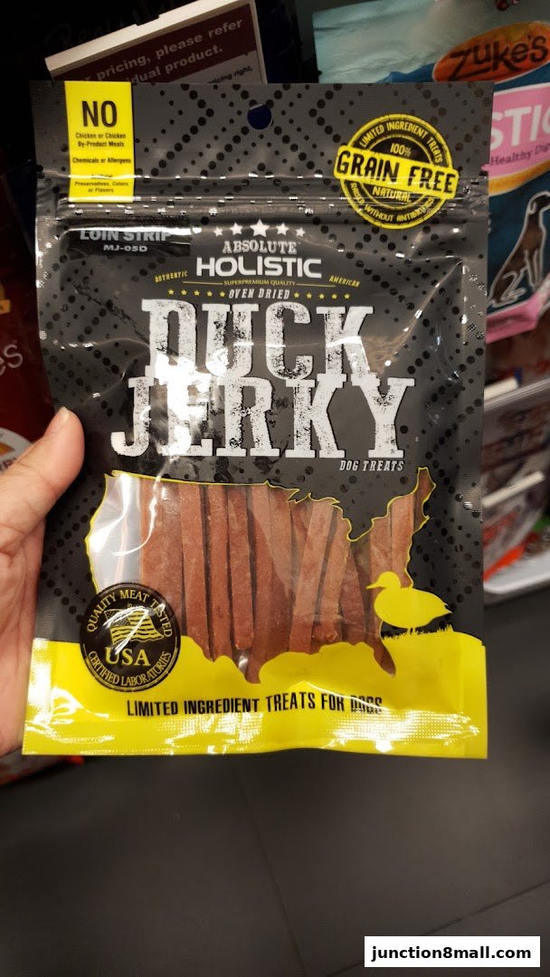 A bag of Absolute Holistic Duck Jerky dog treats with USA certified meat.