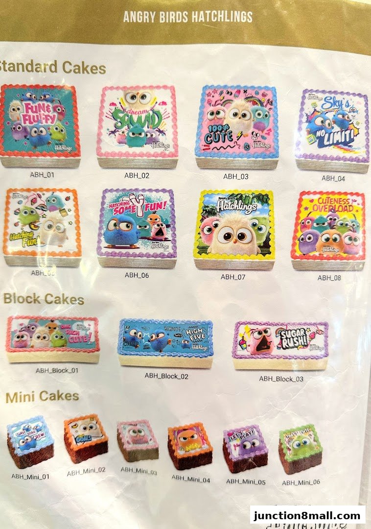 A display of various Angry Birds Hatchlings themed cakes in different sizes and designs.