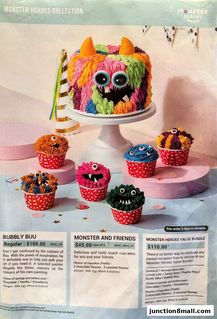 A colorful cake and cupcakes with monster-themed decorations.