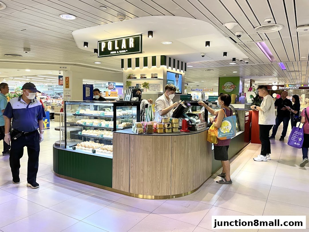 Customers are being served at a Polar Puffs & Cakes counter in a shopping mall.