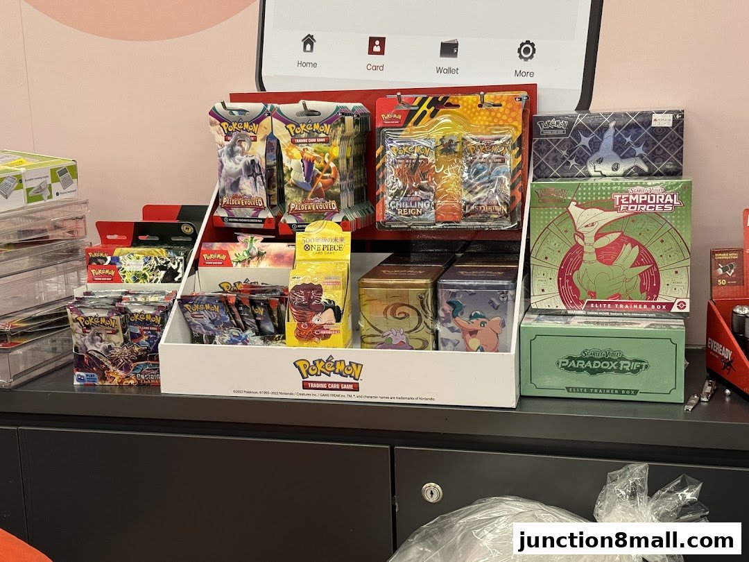 A display of various Pokemon trading card game booster packs and boxes.