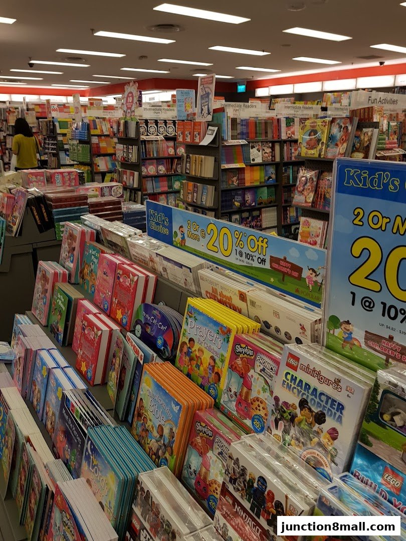 A wide selection of children's books and educational toys displayed in a bookstore.
