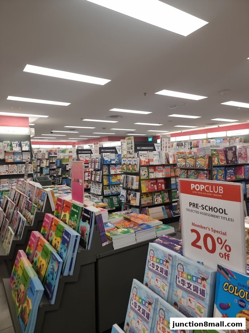 Interior view of a POPULAR bookstore with shelves full of books and educational materials.