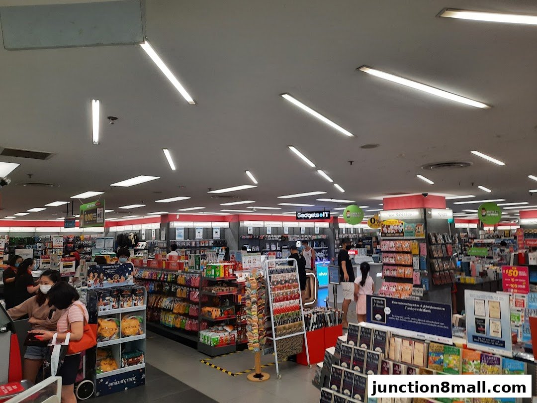 Interior view of a POPULAR Bookstore with shelves stocked with books and merchandise.