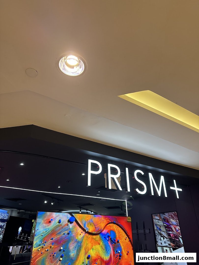 The PRISM+ store features a vibrant display of televisions and modern store signage.
